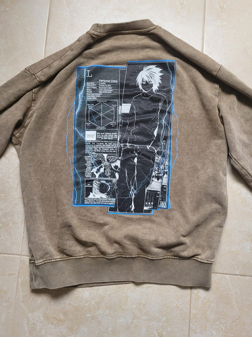 Brown jacket with graphic design on the back on a tiled floor